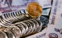 ЦБ оставил официальный курс доллара на выходные и 19 октября ниже ₽84