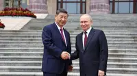 Ушаков назвал интересной идею провести встречу Путина, Си Цзиньпина и Трампа
