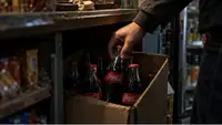 Вдвое дешевле и без чека: Как в России распродают запрещённую Coca-Cola из Грузии